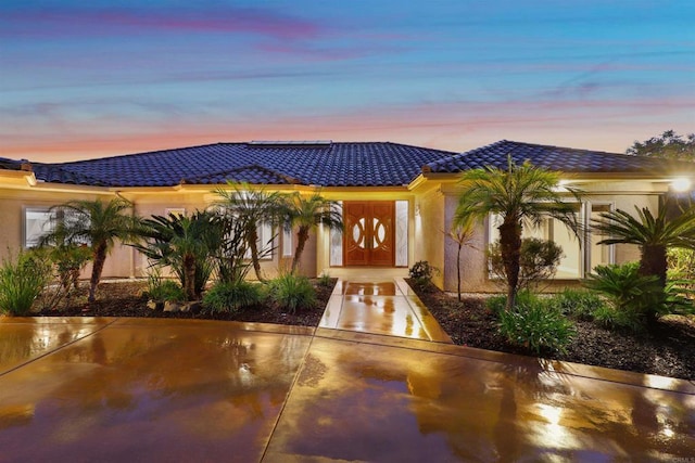 1320 Sleeping Indian Rd, Oceanside, CA 92057 - view of front facade featuring a tile roof and stucco siding