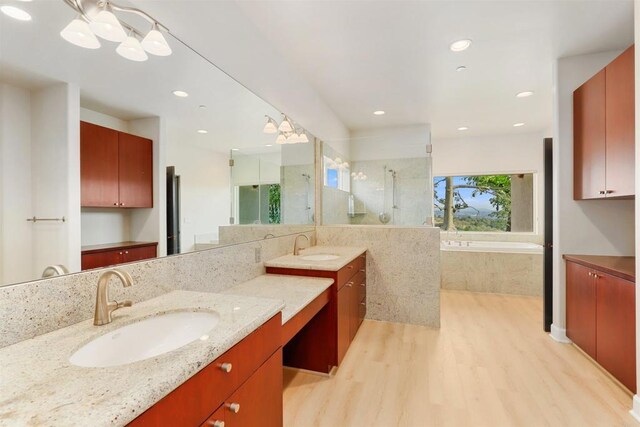 1320 Sleeping Indian Rd, Oceanside, CA 92057 - bathroom with wood finished floors, vanity, an enclosed shower, a garden tub, and recessed lighting