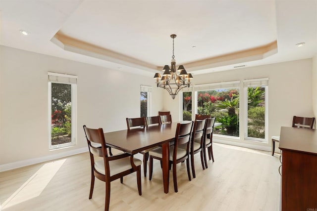1320 Sleeping Indian Rd, Oceanside, CA 92057 - dining space with a tray ceiling, a chandelier, light wood-type flooring, and recessed lighting