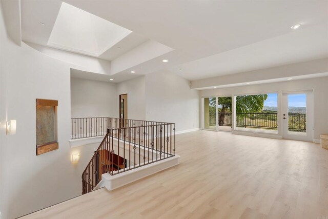 1320 Sleeping Indian Rd, Oceanside, CA 92057 - empty room with a skylight, recessed lighting, wood finished floors, and baseboards