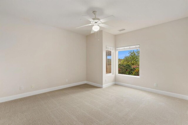 1320 Sleeping Indian Rd, Oceanside, CA 92057 - empty room with baseboards, light carpet, and a ceiling fan