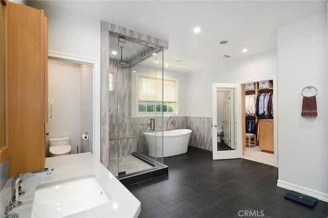 29302 Laro Dr, Agoura Hills, CA 91301 - full bathroom featuring a sink, toilet, a stall shower, a freestanding tub, and recessed lighting