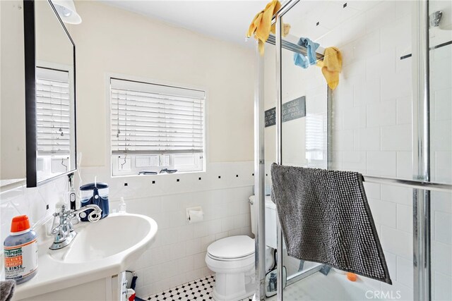 1532 Miramar Dr, Newport Beach, CA 92661 - bathroom featuring tile walls, a shower stall, toilet, a wainscoted wall, and tile patterned floors