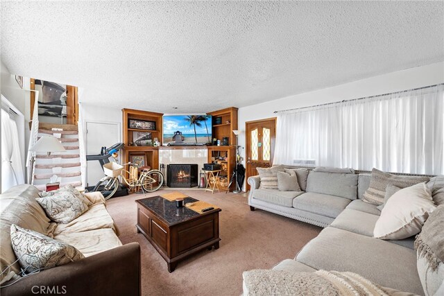 1532 Miramar Dr, Newport Beach, CA 92661 - living room with a textured ceiling, light carpet, and a tiled fireplace