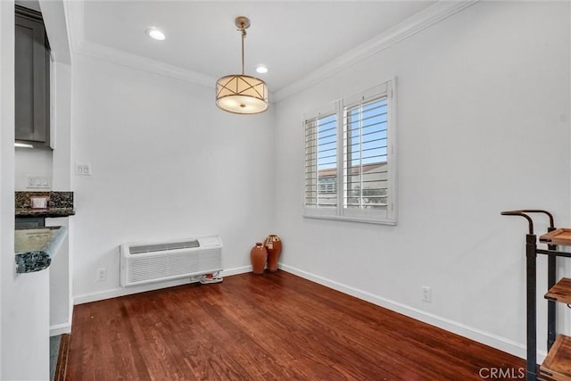 601 Olive Ave Unit L, Long Beach, CA 90802 - unfurnished dining area featuring ornamental molding, a wall unit AC, wood finished floors, baseboards, and recessed lighting