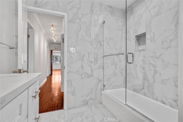 601 Olive Ave Unit L, Long Beach, CA 90802 - full bathroom featuring vanity, bath / shower combo with glass door, and marble finish floors