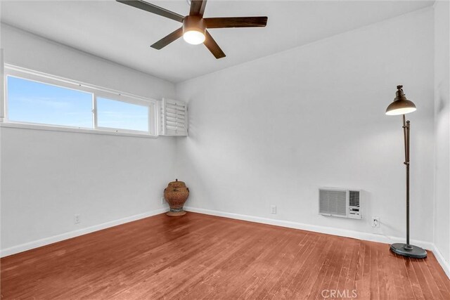 601 Olive Ave Unit L, Long Beach, CA 90802 - spare room with wood finished floors, ceiling fan, and baseboards