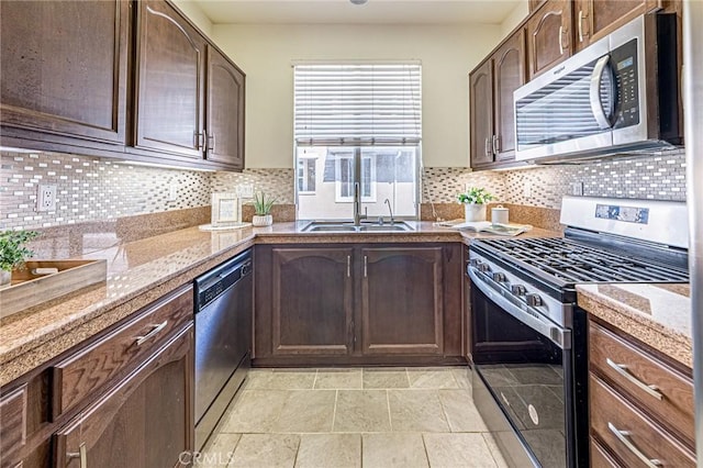 15405 Ashley Ct, Whittier, CA 90603 - kitchen with appliances with stainless steel finishes, a sink, backsplash, and dark brown cabinetry