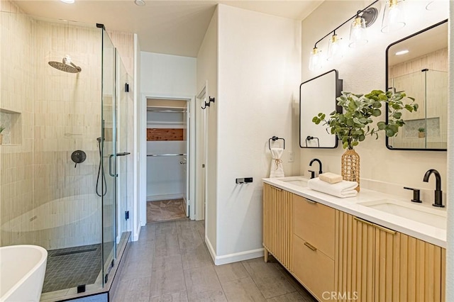 15405 Ashley Ct, Whittier, CA 90603 - full bathroom featuring a shower stall, double vanity, a soaking tub, and a spacious closet