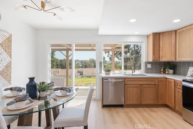 28116 Calle Casal, Mission Viejo, CA 92692 - kitchen featuring stainless steel appliances, light countertops, a sink, tasteful backsplash, and a chandelier
