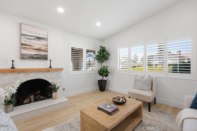 28116 Calle Casal, Mission Viejo, CA 92692 - living room featuring lofted ceiling, wood finished floors, recessed lighting, baseboards, and a fireplace with raised hearth