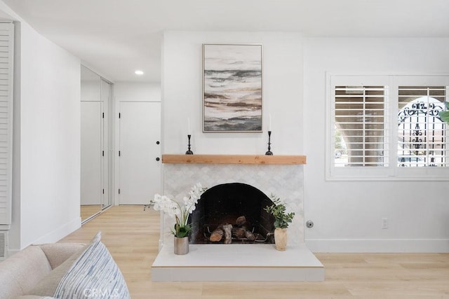 28116 Calle Casal, Mission Viejo, CA 92692 - living area featuring wood finished floors, baseboards, recessed lighting, and a fireplace with raised hearth