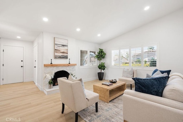 28116 Calle Casal, Mission Viejo, CA 92692 - living area with light wood-style flooring, recessed lighting, baseboards, a premium fireplace, and vaulted ceiling