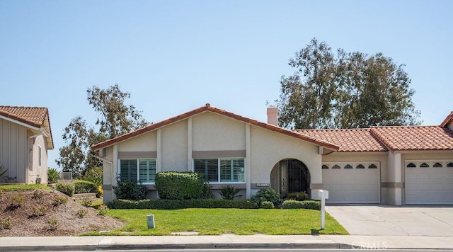 28116 Calle Casal, Mission Viejo, CA 92692 - view of front of home with a garage, a chimney, a tiled roof, a front yard, and driveway
