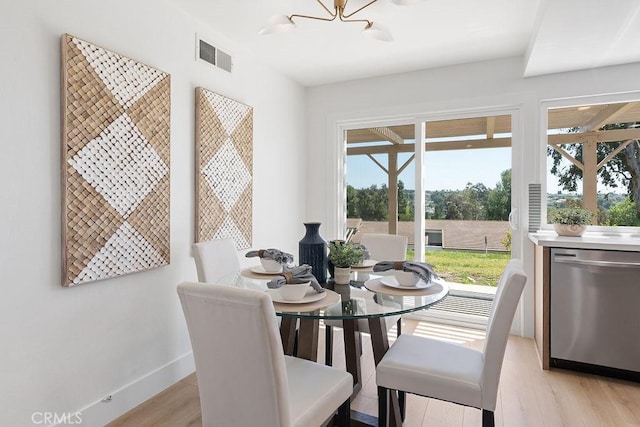 28116 Calle Casal, Mission Viejo, CA 92692 - dining space with light wood-type flooring, a chandelier, and baseboards