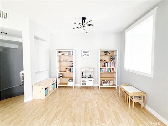 4 Imperial Aisle, Irvine, CA 92606 - playroom with wood finished floors and a chandelier