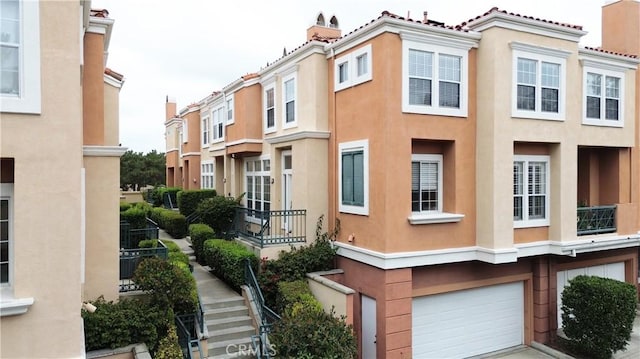 4 Imperial Aisle, Irvine, CA 92606 - view of front of property with stucco siding and a garage