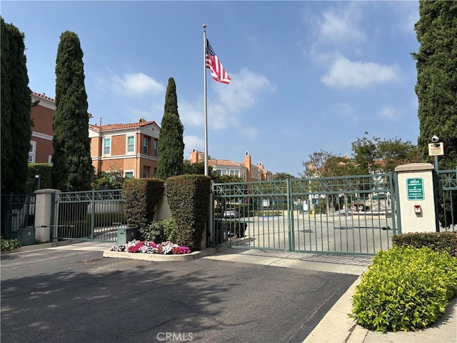 4 Imperial Aisle, Irvine, CA 92606 - view of asphalt street featuring a gate, a gated entry, and curbs