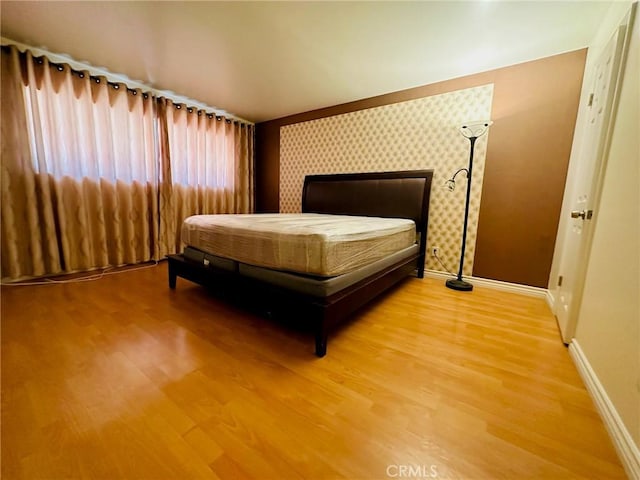 605 N Louise St Unit 106, Glendale, CA 91206 - bedroom with baseboards and light wood-style floors