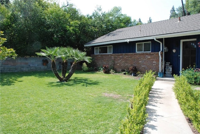 360 Campbell Ave, Redlands, CA 92373 - view of front of house with brick siding, a shingled roof, and a front lawn