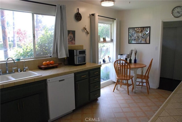 360 Campbell Ave, Redlands, CA 92373 - kitchen featuring dishwasher, plenty of natural light, a sink, and light floors