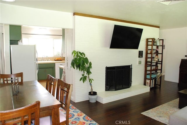 360 Campbell Ave, Redlands, CA 92373 - dining room with wood finished floors, a fireplace, and baseboards