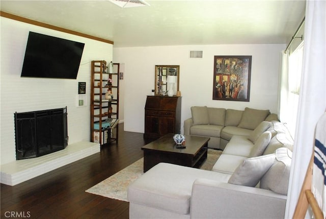 360 Campbell Ave, Redlands, CA 92373 - living area featuring dark wood finished floors and a brick fireplace