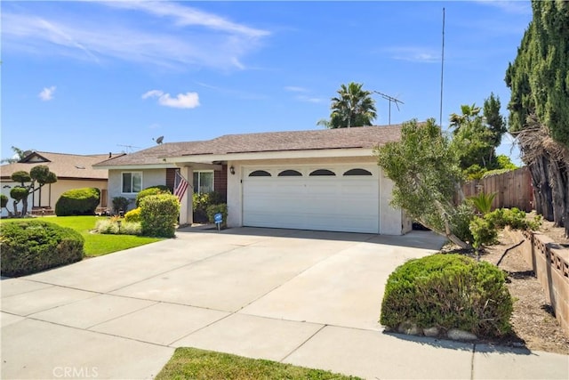 663 Redwood Ave, Upland, CA 91786 - ranch-style home featuring stucco siding, an attached garage, and driveway