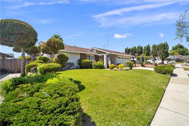 663 Redwood Ave, Upland, CA 91786 - view of front of home featuring a garage and stucco siding