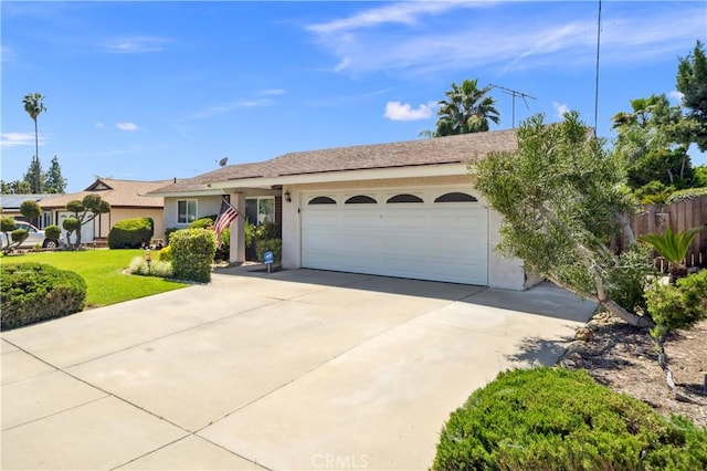 663 Redwood Ave, Upland, CA 91786 - single story home featuring a garage, stucco siding, and driveway