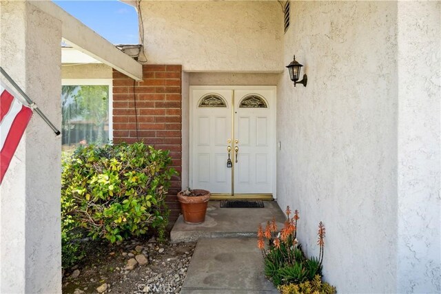 663 Redwood Ave, Upland, CA 91786 - property entrance featuring stucco siding