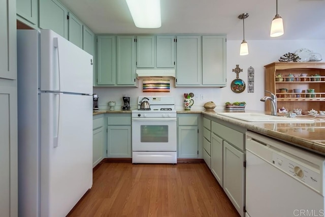 14676 Via Fiesta Unit 2, San Diego, CA 92127 - kitchen featuring white appliances, a sink, under cabinet range hood, wood finished floors, and hanging light fixtures