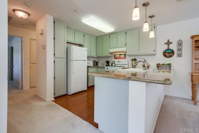 14676 Via Fiesta Unit 2, San Diego, CA 92127 - kitchen with white appliances, green cabinets, a peninsula, and light carpet