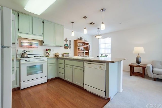 14676 Via Fiesta Unit 2, San Diego, CA 92127 - kitchen featuring white appliances, a sink, a peninsula, green cabinetry, and under cabinet range hood