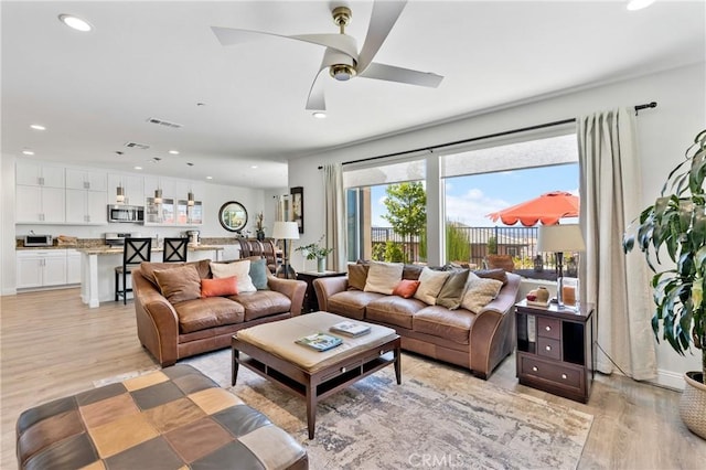 18106 Meridian Ln, Saugus, CA 91350 - living area featuring light wood-style floors, recessed lighting, and a ceiling fan