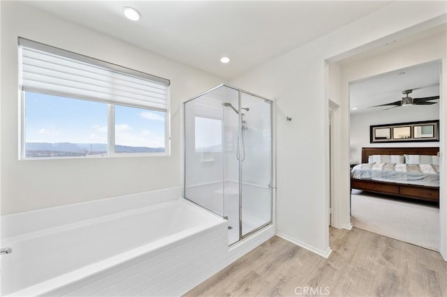 18106 Meridian Ln, Saugus, CA 91350 - ensuite bathroom with a garden tub, a stall shower, wood finished floors, recessed lighting, and a ceiling fan