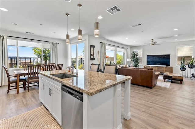 18106 Meridian Ln, Saugus, CA 91350 - kitchen with dishwasher, a sink, ceiling fan, light wood-style floors, and recessed lighting