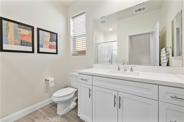18106 Meridian Ln, Saugus, CA 91350 - full bath featuring wood finished floors, toilet, vanity, baseboards, and a shower stall
