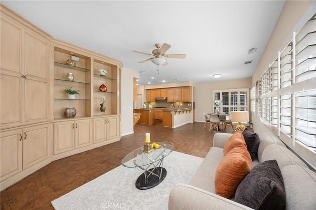 5675 W Overlook Dr, Rancho Cucamonga, CA 91739 - living room with a ceiling fan, dark tile patterned flooring, and baseboards