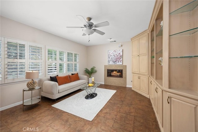 5675 W Overlook Dr, Rancho Cucamonga, CA 91739 - living room featuring ceiling fan, baseboards, and a glass covered fireplace