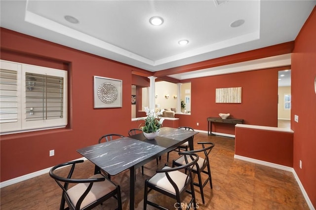 5675 W Overlook Dr, Rancho Cucamonga, CA 91739 - dining space featuring ornate columns, a raised ceiling, baseboards, and recessed lighting