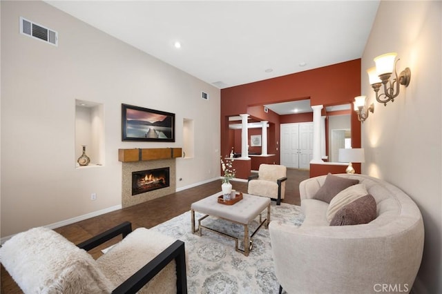 5675 W Overlook Dr, Rancho Cucamonga, CA 91739 - living area featuring a fireplace, baseboards, ornate columns, and recessed lighting