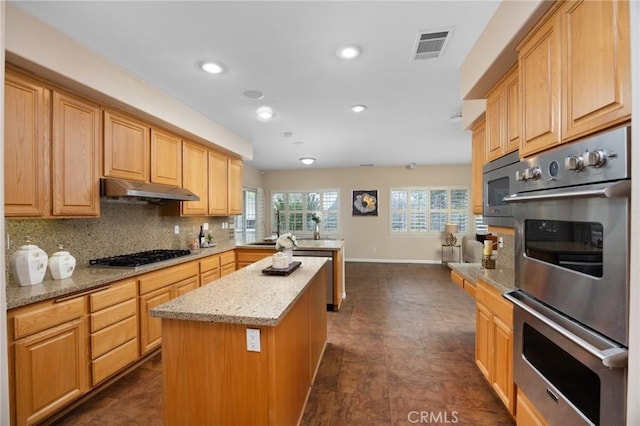 5675 W Overlook Dr, Rancho Cucamonga, CA 91739 - kitchen with under cabinet range hood, appliances with stainless steel finishes, a peninsula, backsplash, and recessed lighting