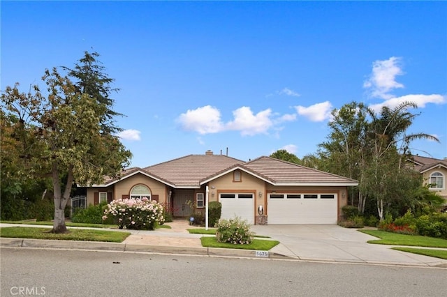 5675 W Overlook Dr, Rancho Cucamonga, CA 91739 - ranch-style house featuring driveway, a garage, and a tile roof
