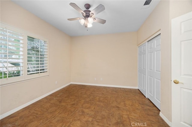 5675 W Overlook Dr, Rancho Cucamonga, CA 91739 - unfurnished bedroom featuring a closet, baseboards, tile patterned floors, and a ceiling fan