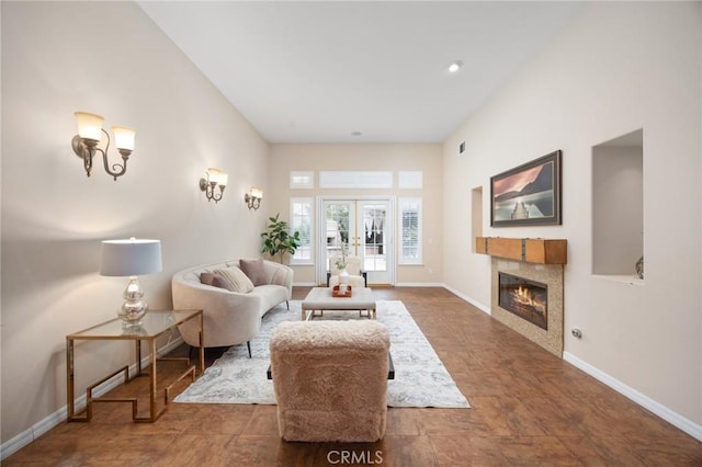5675 W Overlook Dr, Rancho Cucamonga, CA 91739 - living area with french doors, a tiled fireplace, and baseboards