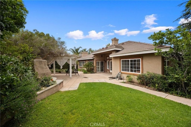 5675 W Overlook Dr, Rancho Cucamonga, CA 91739 - back of property with stucco siding, a yard, a patio, a chimney, and a pergola