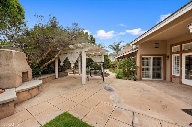 5675 W Overlook Dr, Rancho Cucamonga, CA 91739 - view of patio with an outdoor fireplace and a pergola