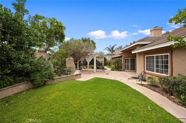5675 W Overlook Dr, Rancho Cucamonga, CA 91739 - view of yard featuring a pergola and a patio area