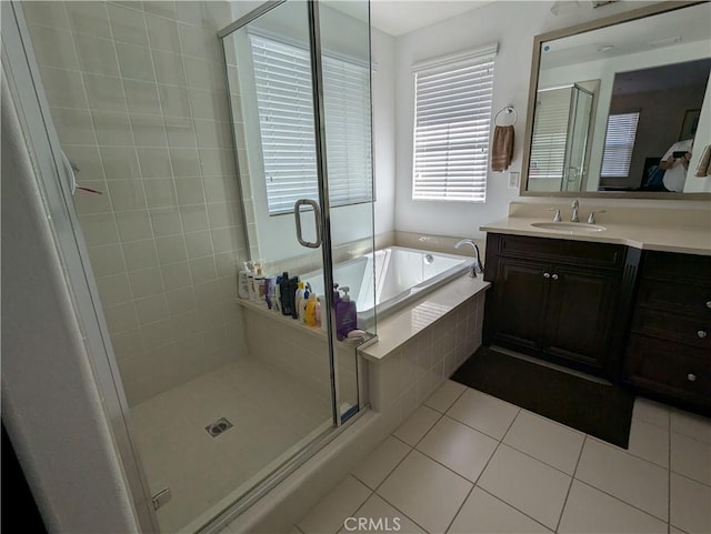 753 Huron Pl, Claremont, CA 91711 - full bath featuring tile patterned flooring, vanity, a garden tub, and a stall shower